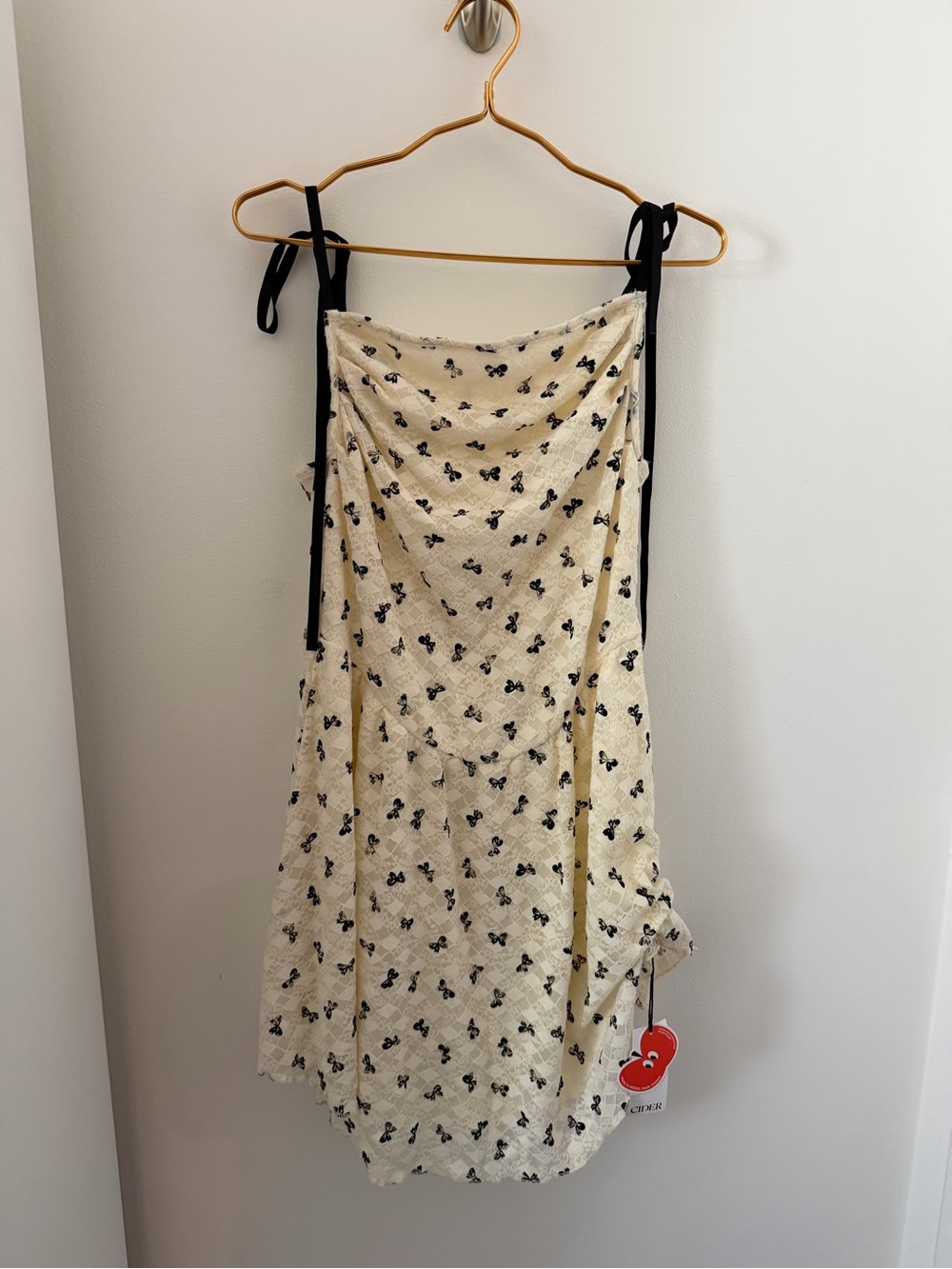 Cider Cream Mini Dress with Black Bow Print and Tie Straps